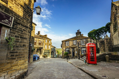 Old street in Yorkshire with red phone booth